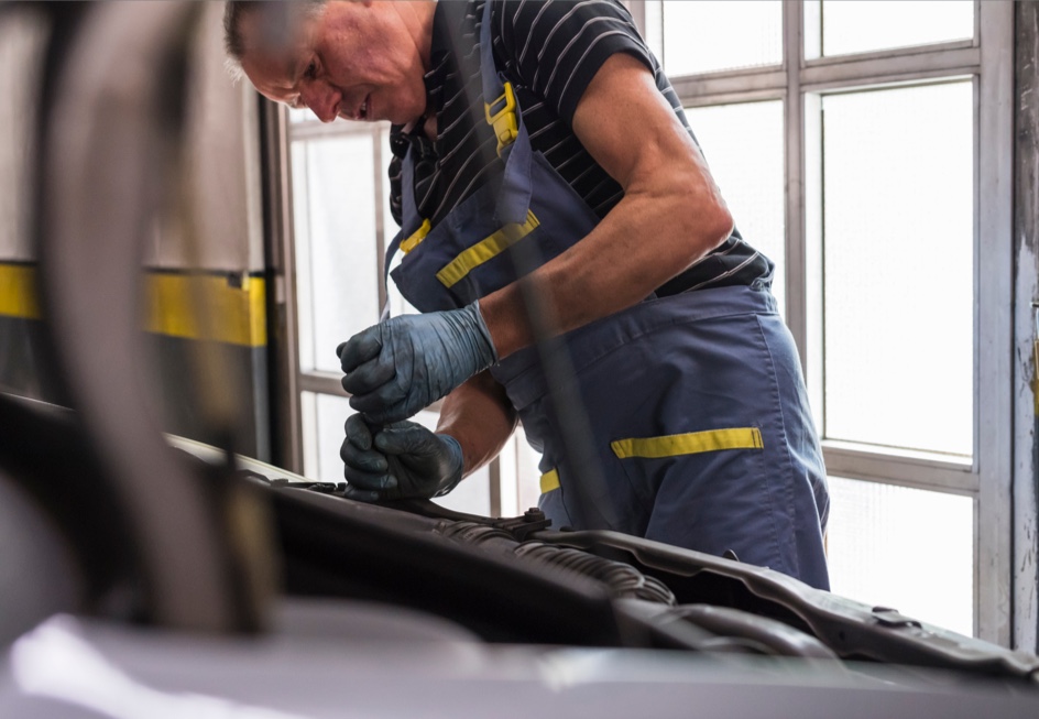 Mechanic working on a passenger car engine