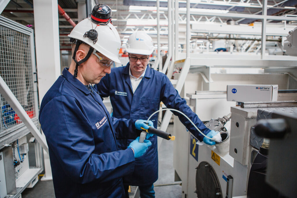 Mobipol technicians taking an oil sample